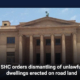 SHC orders dismantling of unlawful dwellings erected on road land